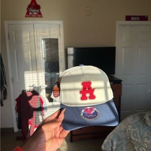 Cream and Blue Baseball Cap with Red 'A' Patch